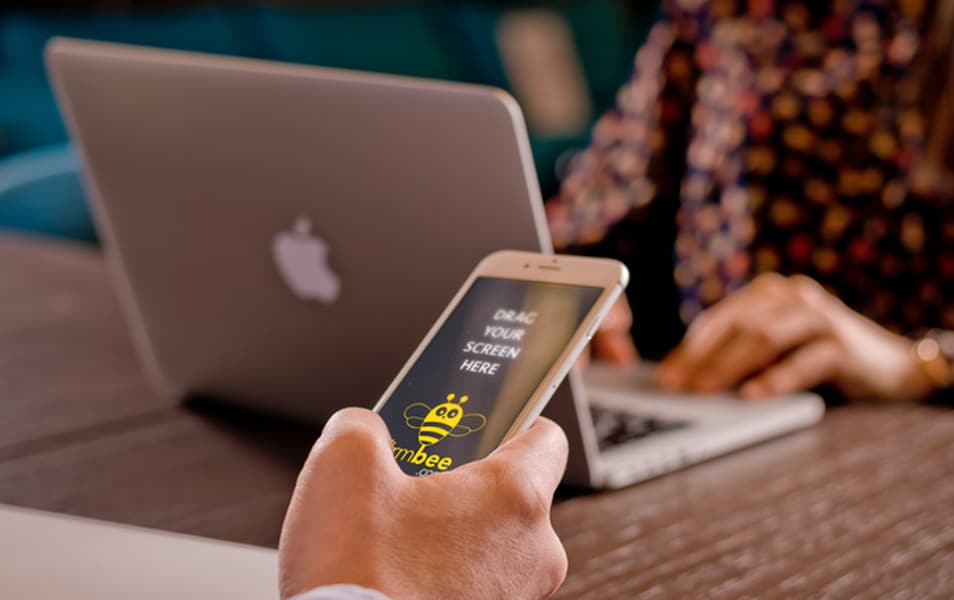 iPhone 6 on man’s hand Free PSD mockup