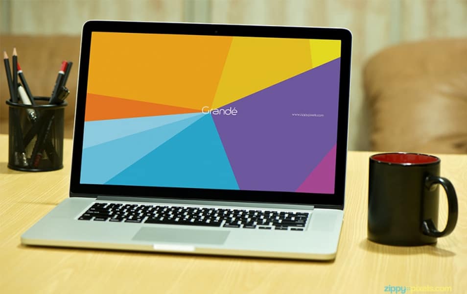 Free Photorealistic Device Mockup of Macbook Pro