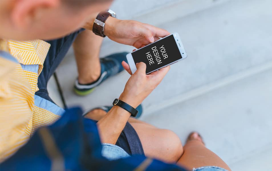 Man Holding iPhone Mockup