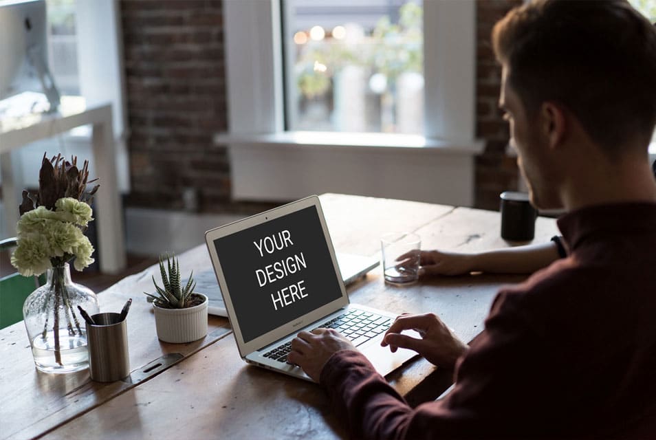 Man Using Macbook Mockup 2 Man Using Macbook Mockup