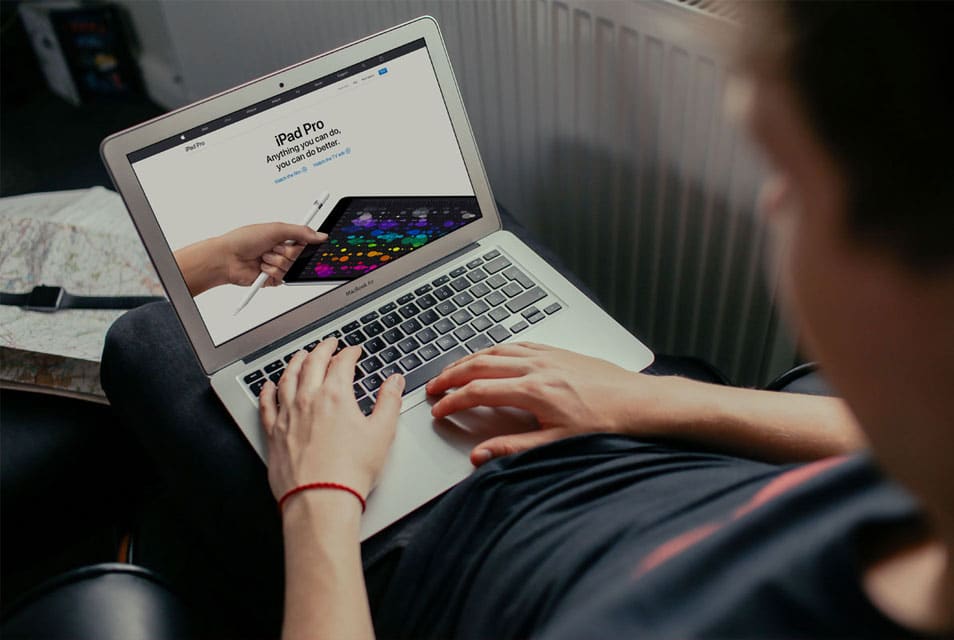 Young Man Working on his Macbook Air 2 Young Man Working on his Macbook Air