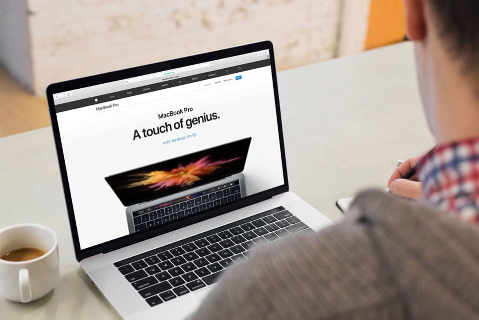 Young Man Working on his Macbook 2 Young Man Working on his Macbook