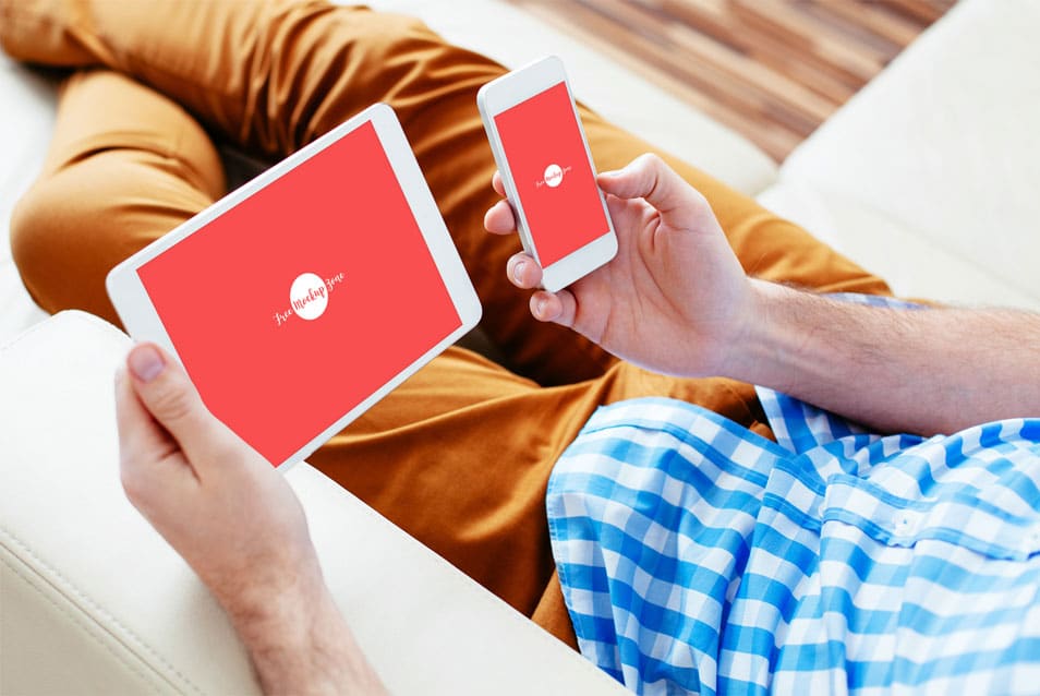 Free Man Carrying Smart Phone & Tablet Mock-up 2 Free Man Carrying Smart Phone & Tablet Mock-up