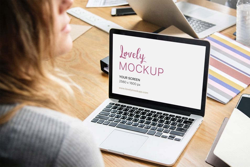 Macbook Mockup and A Young Woman Talking to Her Coworker 2 Macbook Mockup and A Young Woman Talking to Her Coworker