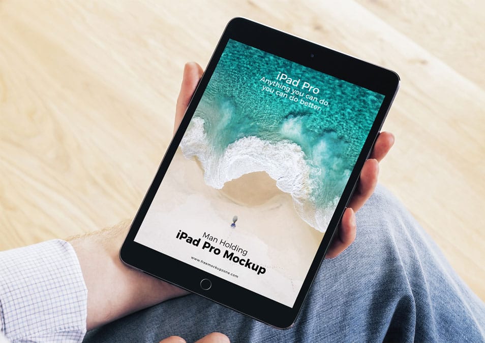 Free Man Holding iPad Pro Mockup 2 Free Man Holding iPad Pro Mockup