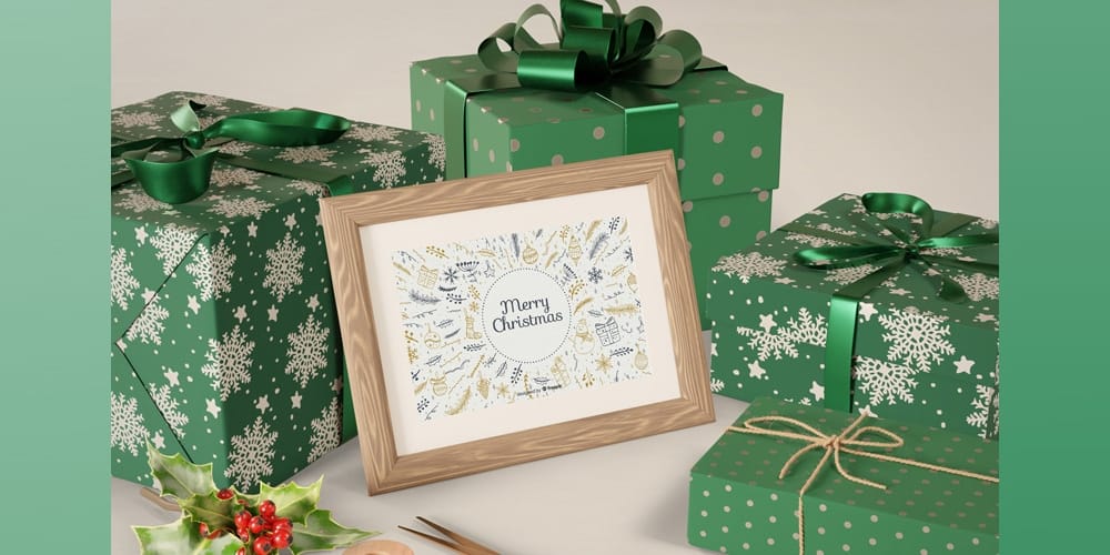 Free Scene Creators and Mockups for Christmas Greetings 16 Painting on Table beside wrapped Gifts Mockup