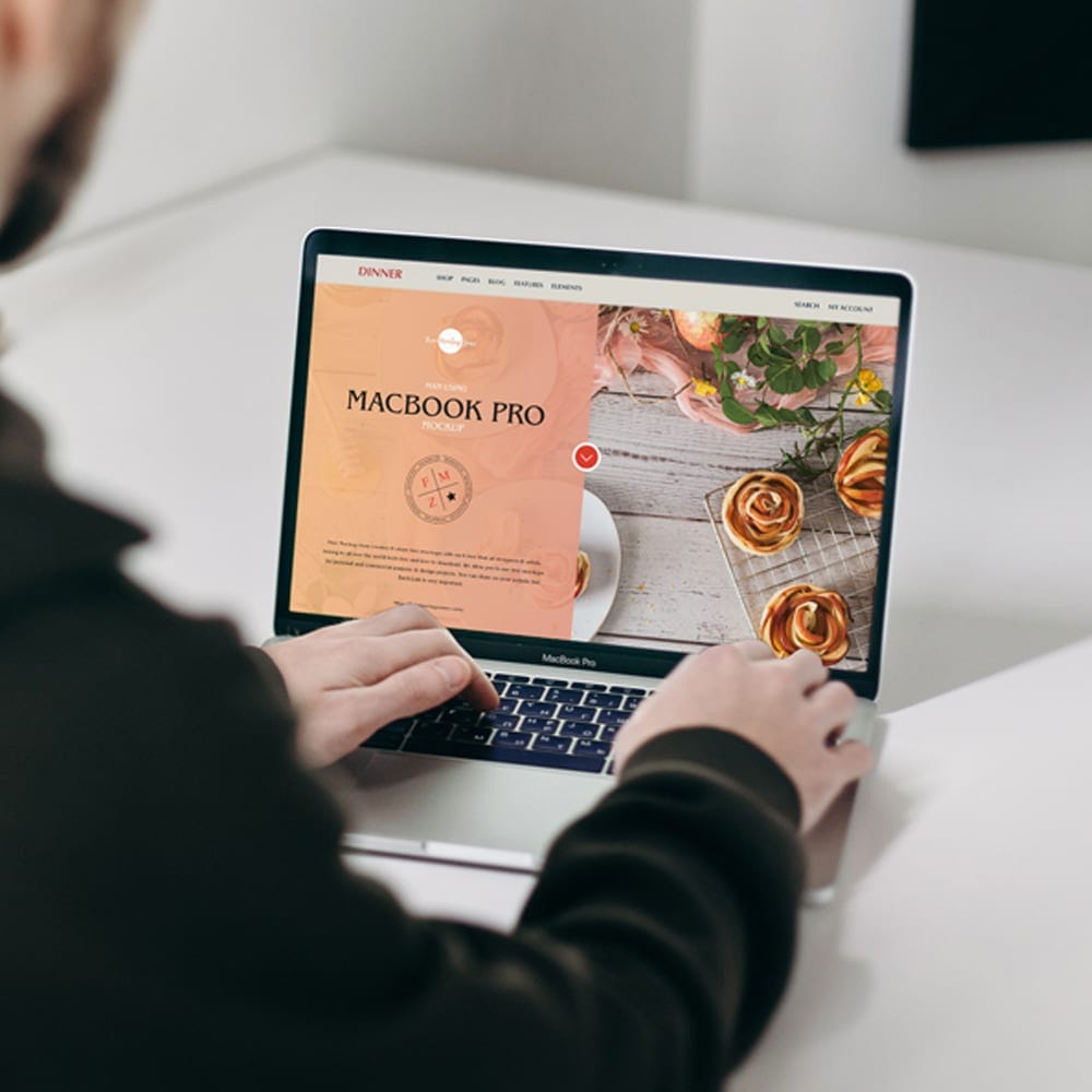 Free Man Using MacBook Pro Mockup 1 Free Man Using MacBook Pro Mockup