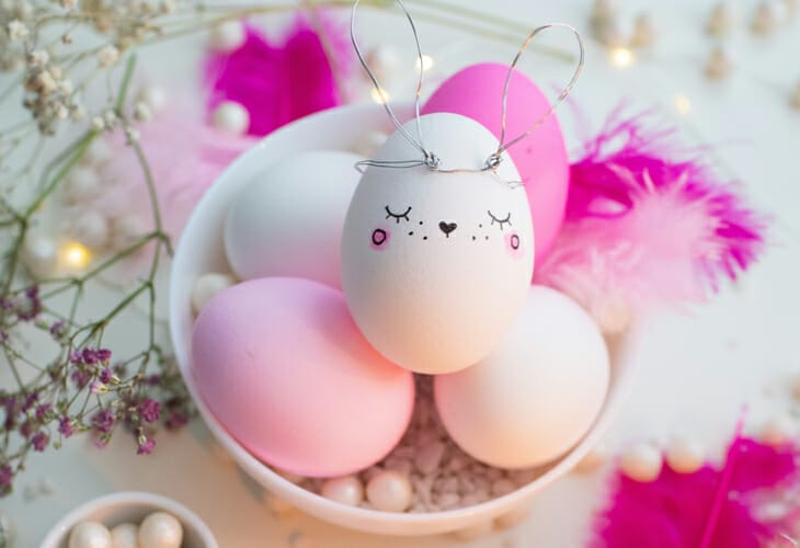 Pink and White Decorated Eggs on Table