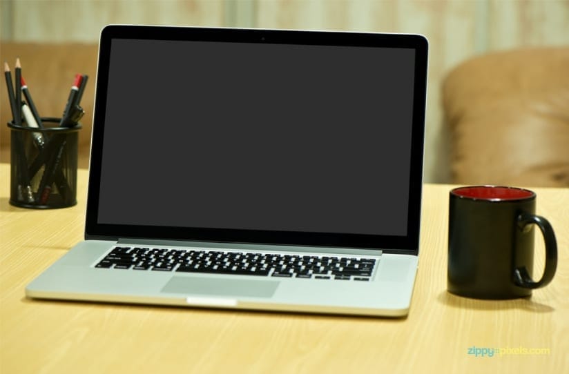 Free Photorealistic Device Mockup of Macbook Pro