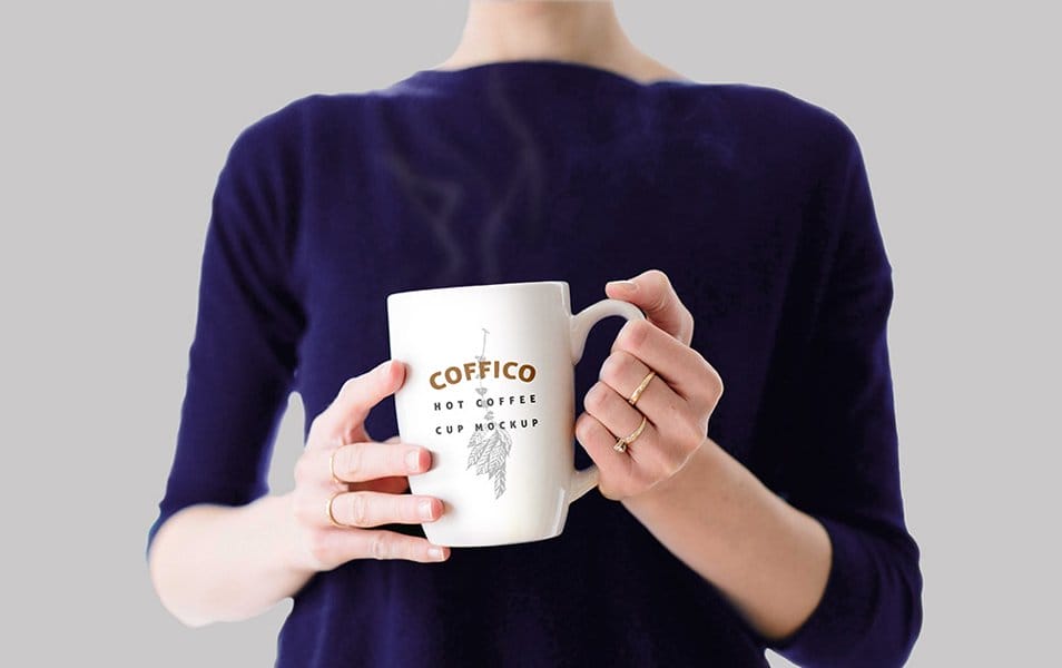 Woman Holding a Coffee Mug Mockup PSD