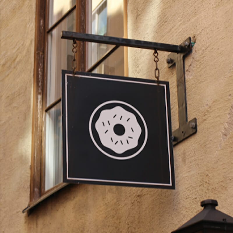 Free Mockup of a Vintage Framed Swing Sign