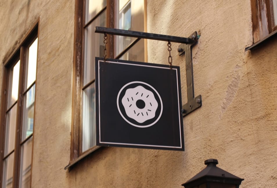 Free Mockup of a Vintage Framed Swing Sign