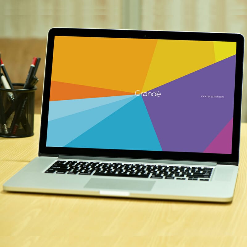 Free Photorealistic Device Mockup of Macbook Pro