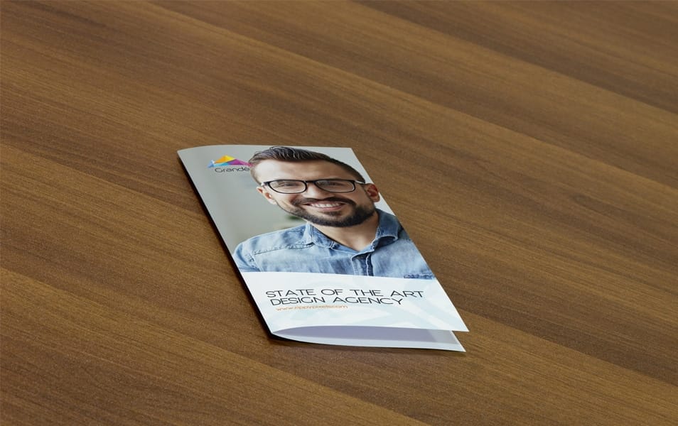 Free Photorealistic PSD Mockup of Bifold Flyer