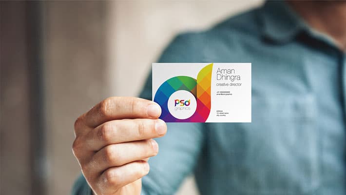Man Holding Business Card Mockup PSD