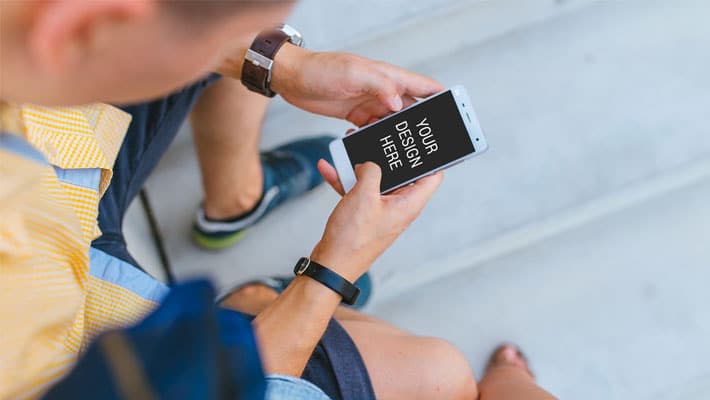 Man Holding iPhone Mockup
