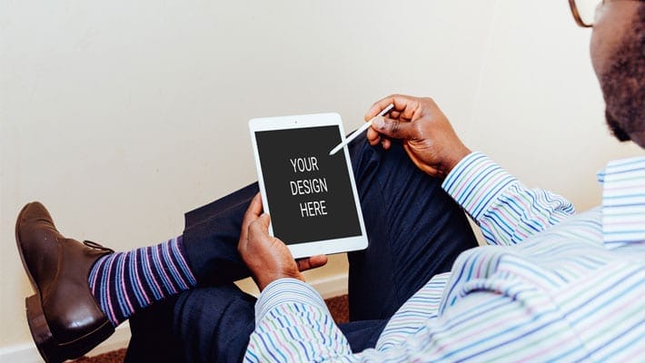 Man Using iPad Air Mockup