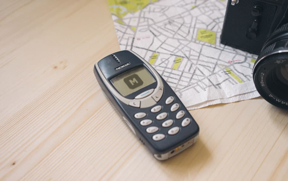Nokia 3310 on a Wooden Desk