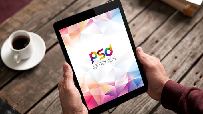 iPad in Hand Mockup Free PSD
