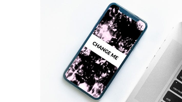 iPhone X on Desk with Macbook