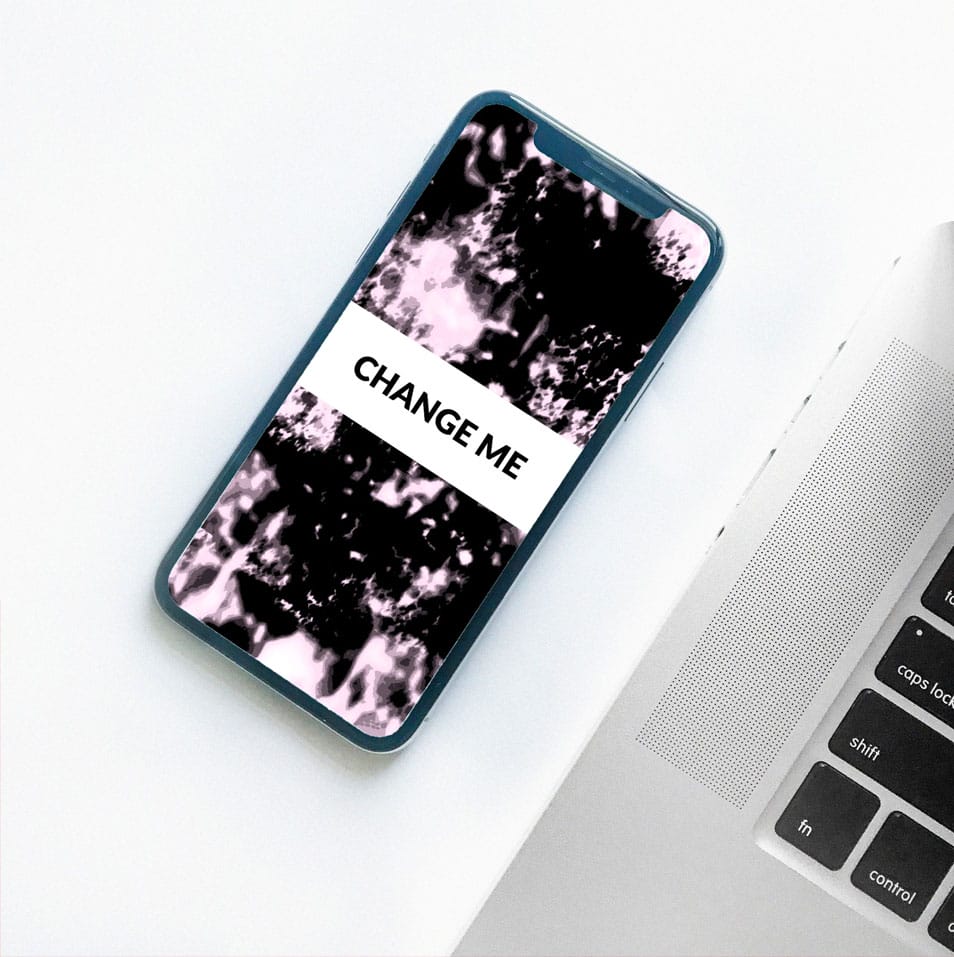 iPhone X on Desk with Macbook