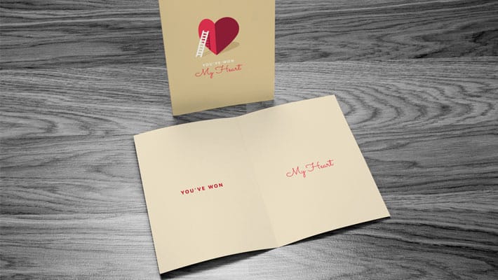 Free Greeting Card Mock-up with Wooden Background