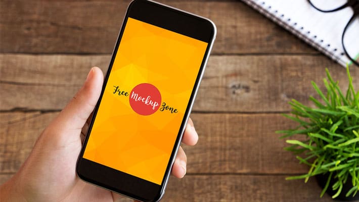 Free Hand Holding Clean Smartphone Mockup