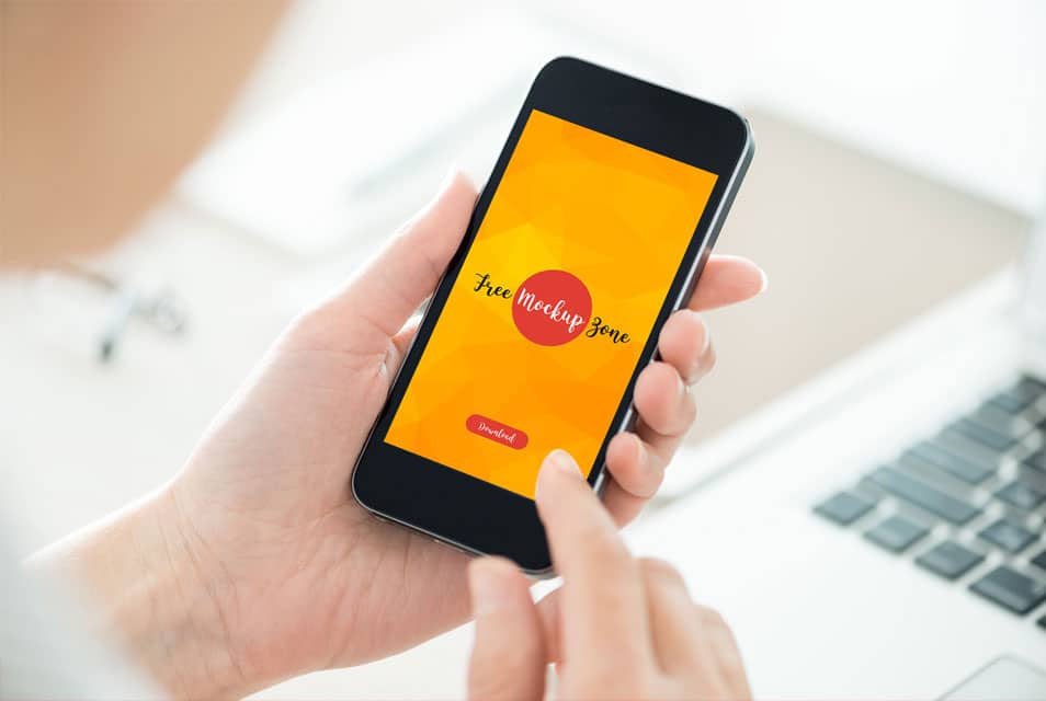 Free Person Holding Smartphone Mockup