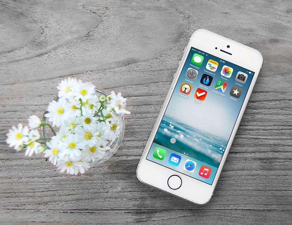 Free iPhone Mockup with Wooden Background