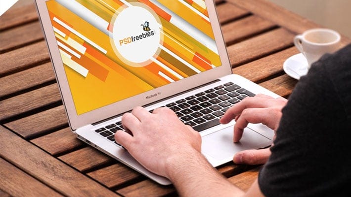 Man Working on Macbook Mockup PSD