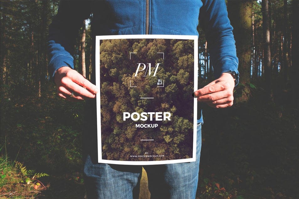 Man in Forest Holding Poster Mockup PSD