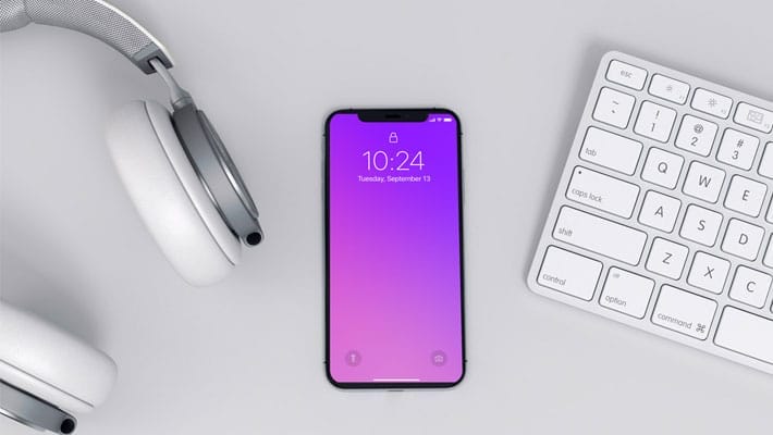 Modern iPhone X Mockup on a Workspace