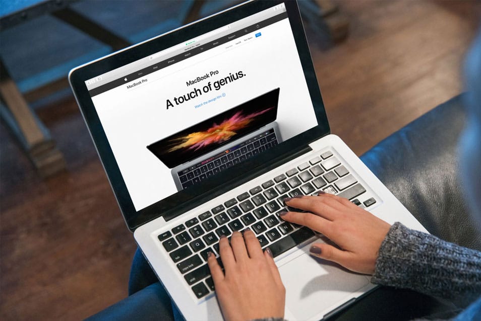 Young Lady Typing Code on Macbook Pro Mockup