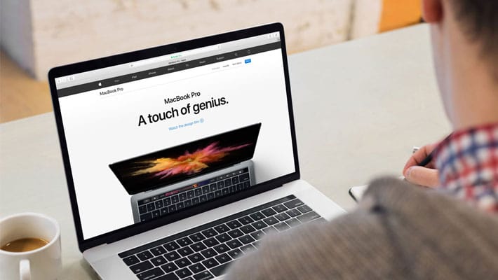 Young Man Working on his Macbook