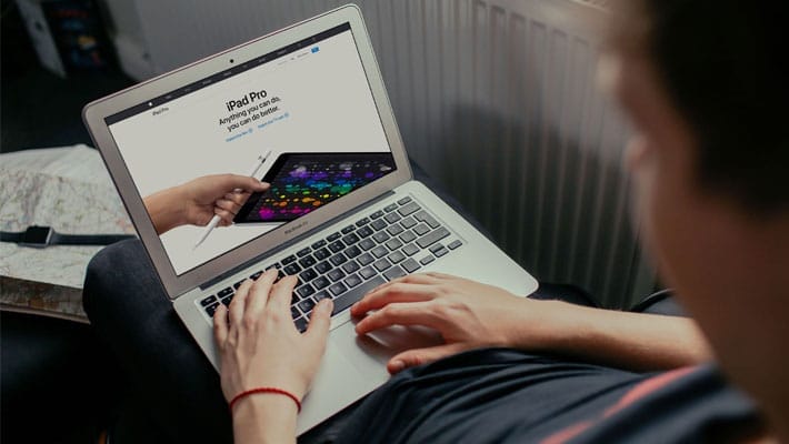 Young Man Working on his Macbook Air