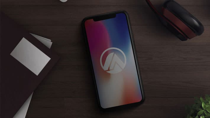 iPhone X in Desk Mockup PSD