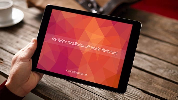 Free Tablet in Hand Mockup