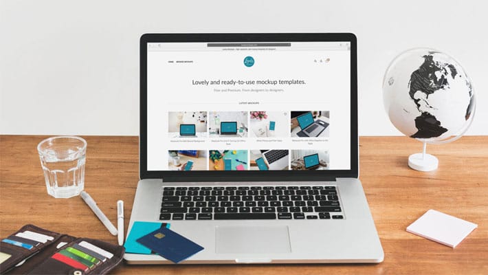 Macbook Mockup With Credit Cards on Table