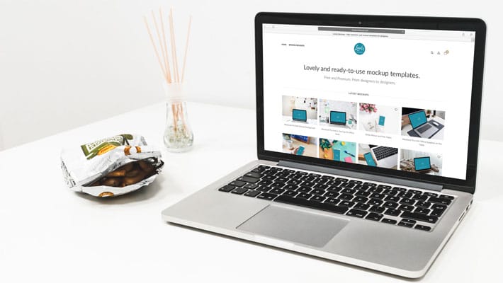 Macbook Mockup With Snacks On The Table