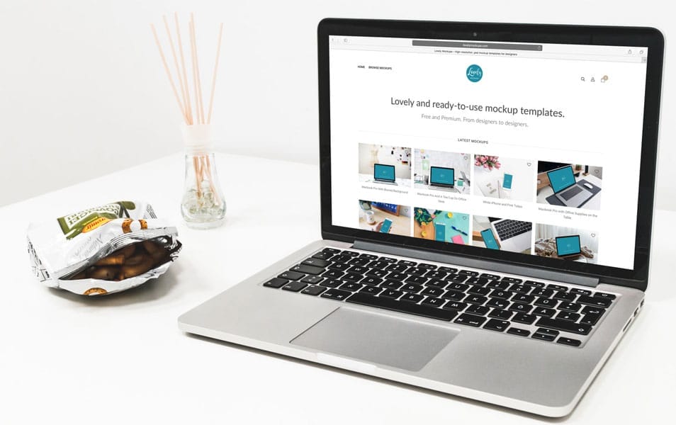 Macbook Mockup With Snacks On The Table