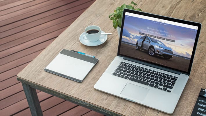 Macbook Next To A Fresh Morning Coffee