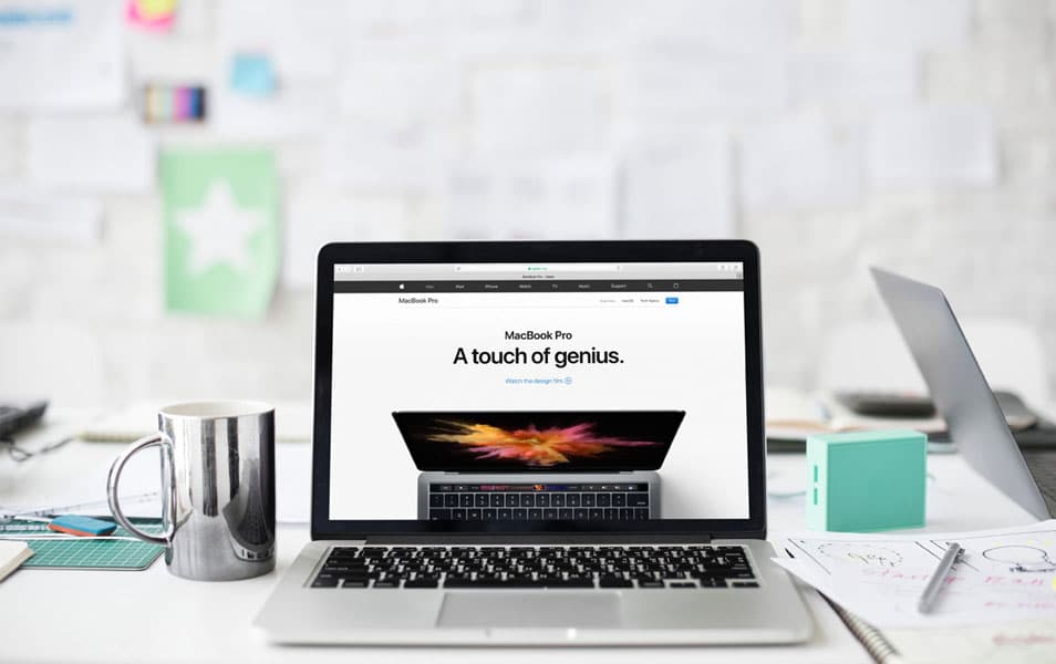 Macbook Pro And A Tea Cup On Office Desk