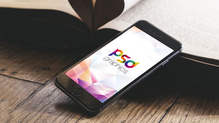 iPhone on Wooden Table Mockup Free PSD