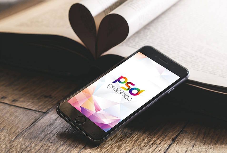 iPhone on Wooden Table Mockup Free PSD