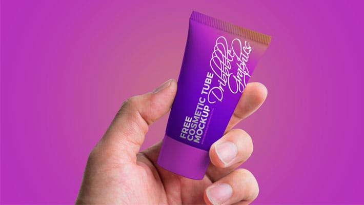 Free Man Holding Cosmetic Tube Mockup