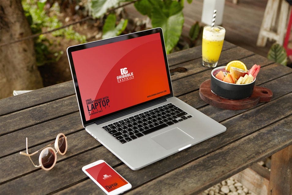 Free Smartphone With Laptop Mockup on Wooden Table