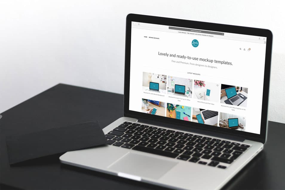 Macbook Pro On A Black Table Mockup