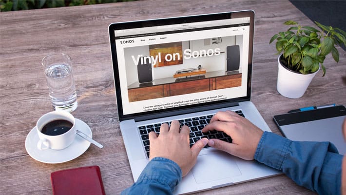 Male freelancer working on Macbook Mockup