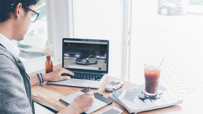 Man Working on a Macbook Pro Mockup