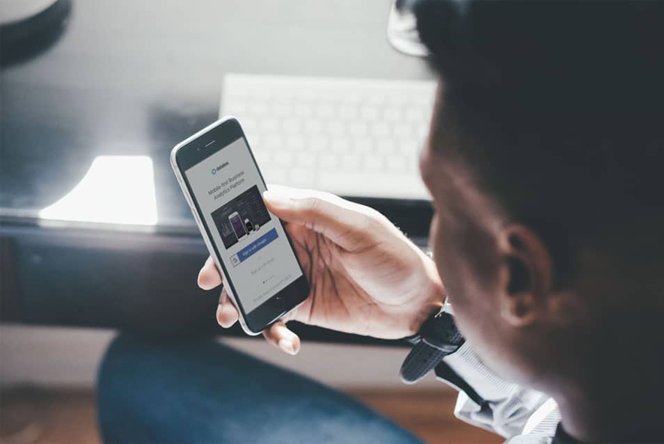 Man viewing on iPhone Screen Mockup